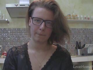 Solo mademoiselle with glasses chatting in the kitchen